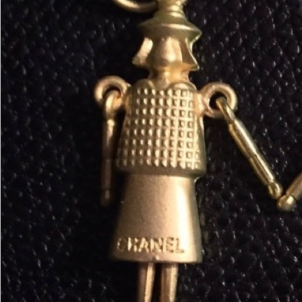 - - Mademoiselle CoCo Doll. Has a couple scuffs. Great for pendant, keychain.